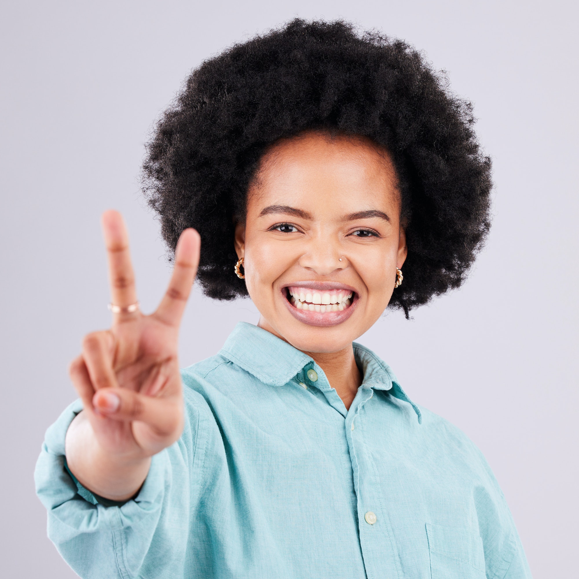 Smile, peace sign and portrait of black woman in studio for positive, agreement and support. Confid